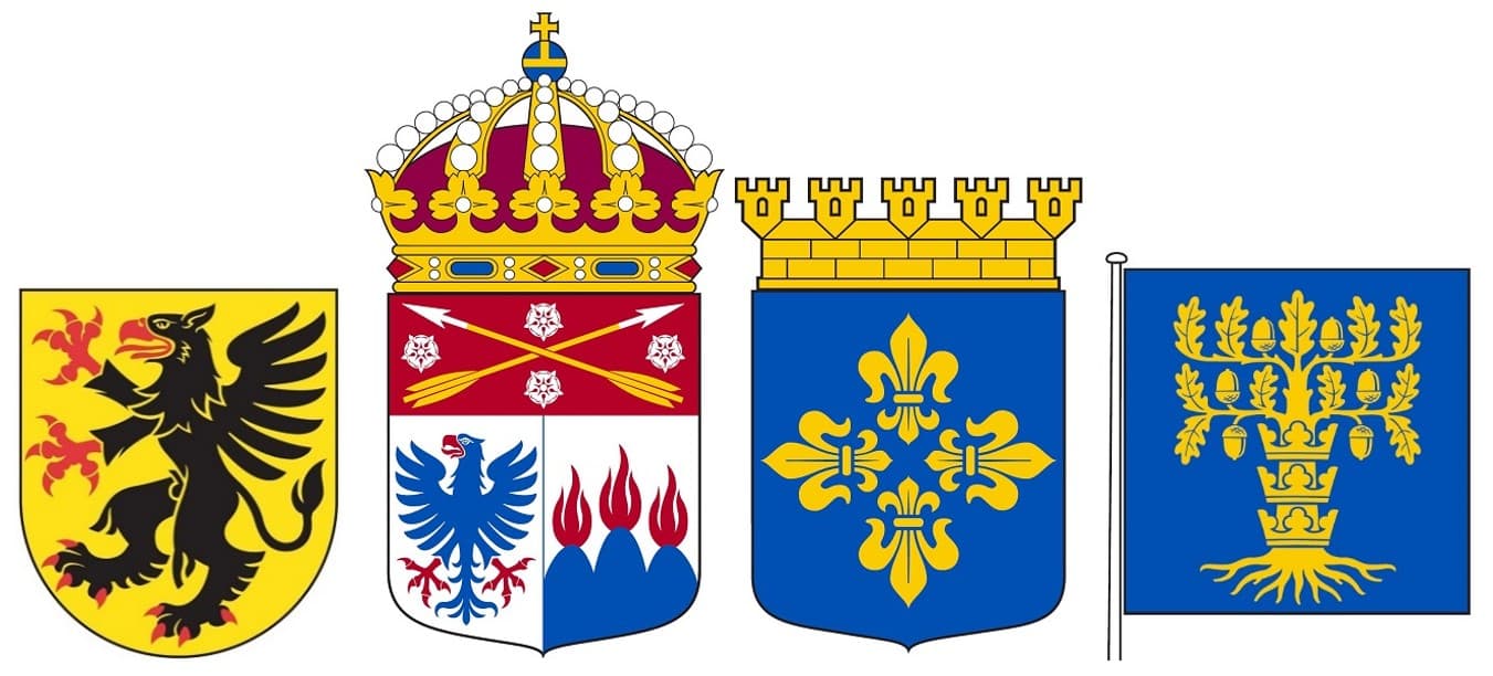 Fyra vapen bredvid varandra: I fält av guld en upprest svart grip med röd beväring, En på guldfält anbragt till vänster seende svart örn med röd näbb och röda fötter, åtföljd till höger om huvudet av en blå sexuddig stjärna och till vänster av en halvmåne i samma färg, En blå sköld med fyra korsformigt ställda liljor av guld, och sist I blått fält en ek med tre kronor uppträdda på stammen, allt i guld.