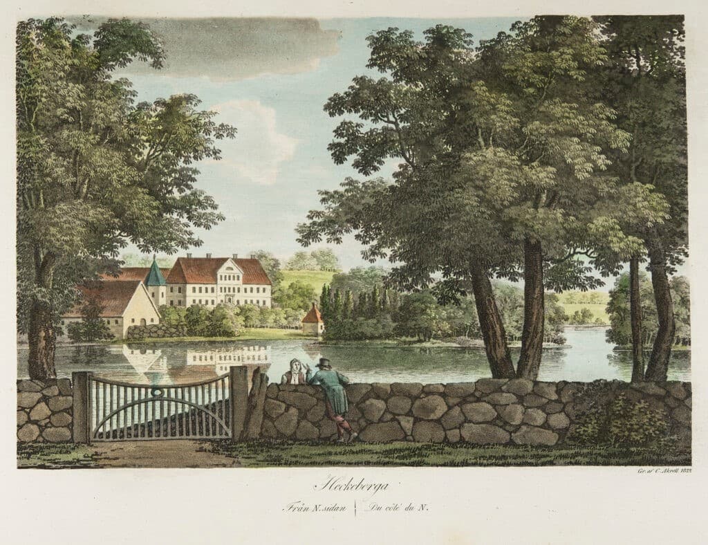 På bilden syns två personer som samtalar med varandra från varsin sida av en mur. I bakgrunden syns en större byggnad.